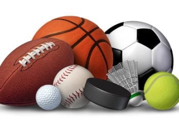 Sports equipment with a football basketball baseball soccer tennis and golf ball and badminton hockey puck as recreation and leisure fun activities for team and individual playing.
